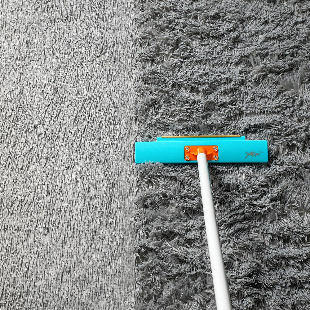 Jolllax Carpet Rake reviving flattened carpet fibers, showing lifted and refreshed pile after grooming.